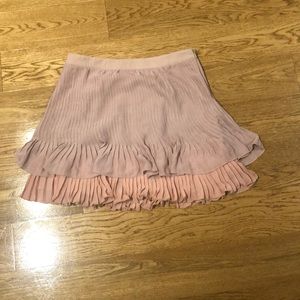 Blush colored, pleated mini skirt
